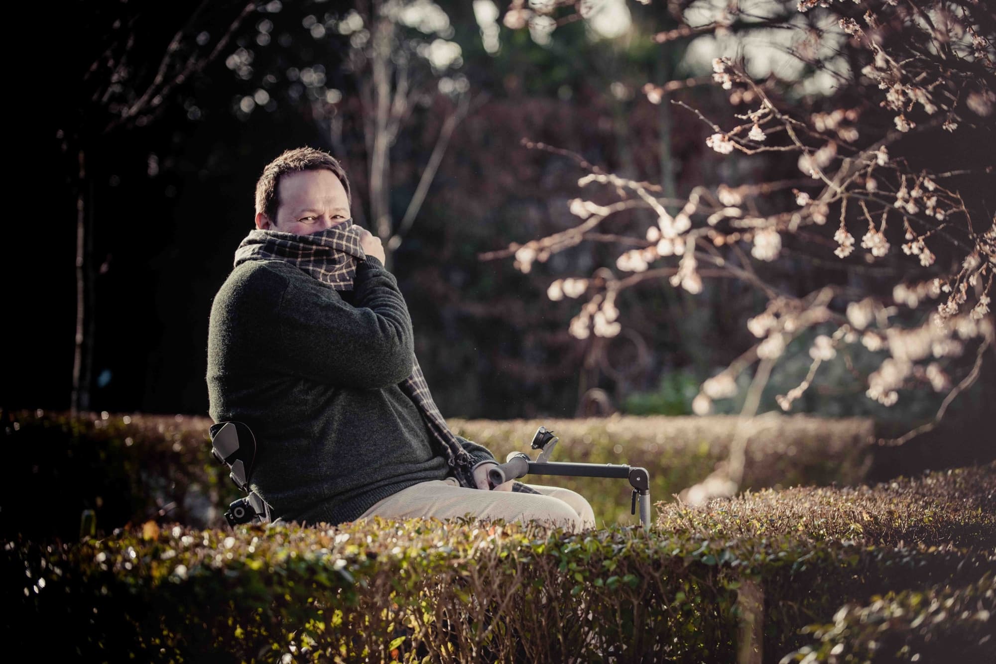 Mark Lane sat in a winter garden in the cold