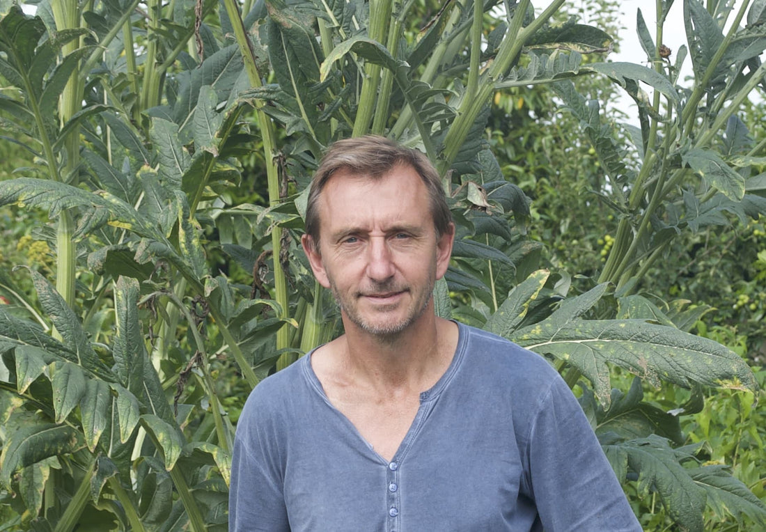 Dave Goulson in front of a leafy green background