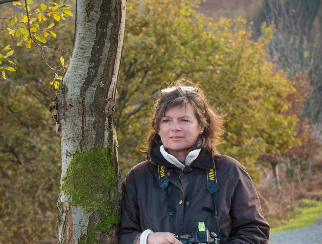 Image by Jonathan Buckley of Andrea Jones posing by a tree