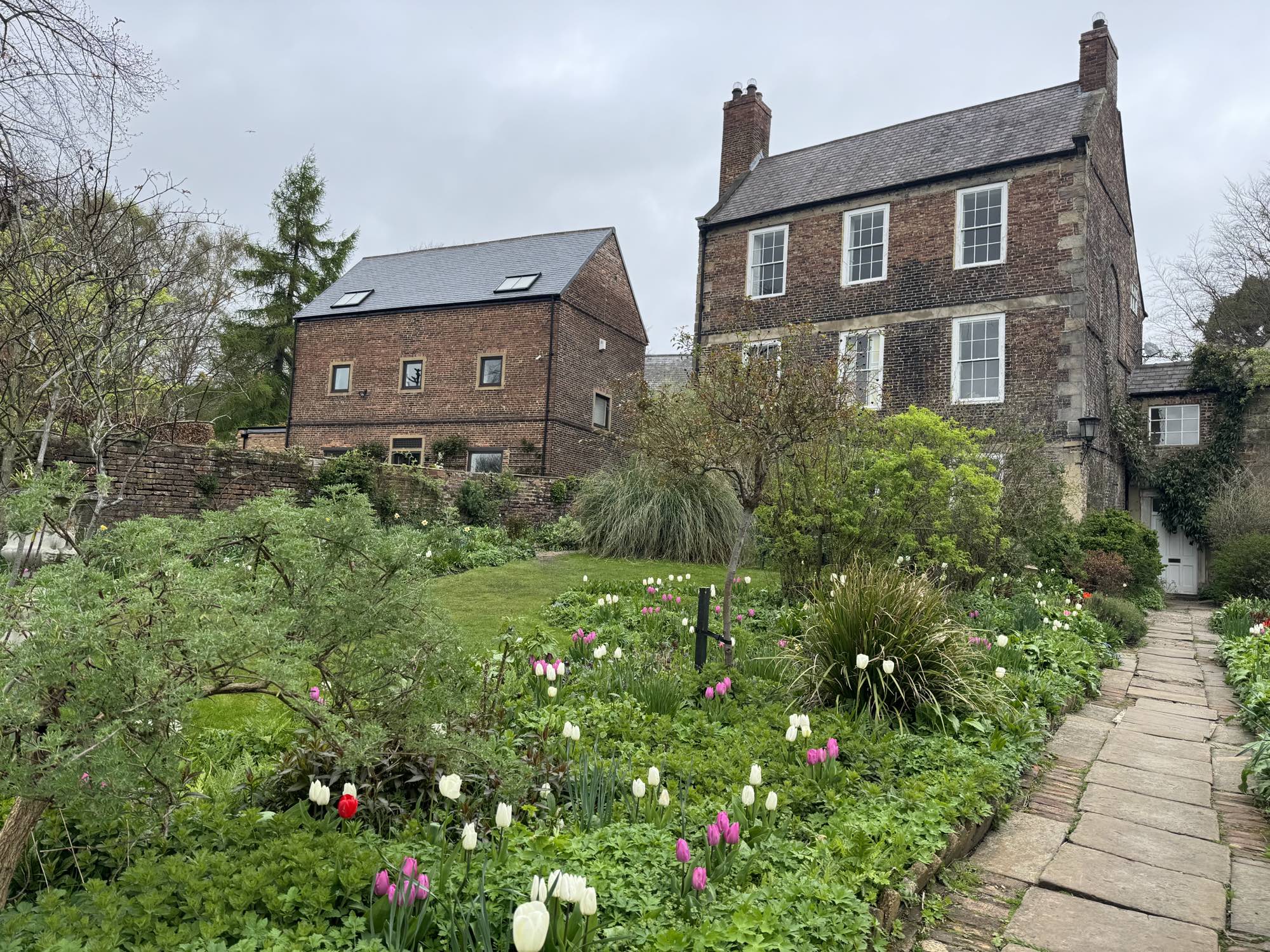 the walled garden at Crook Hall full of daffodils and tulips