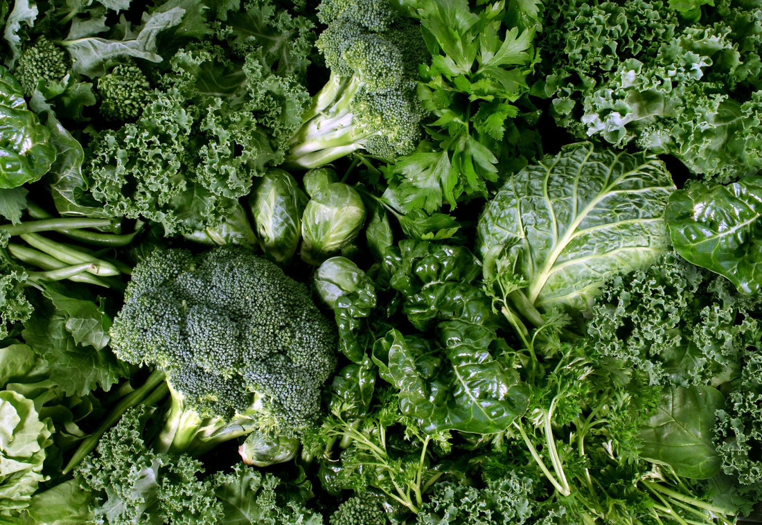 a variety of different green leafy vegetables including broccoli, cabbage and lettuce all lying next to each other