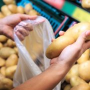 potatoes being bagged in a supermarket
