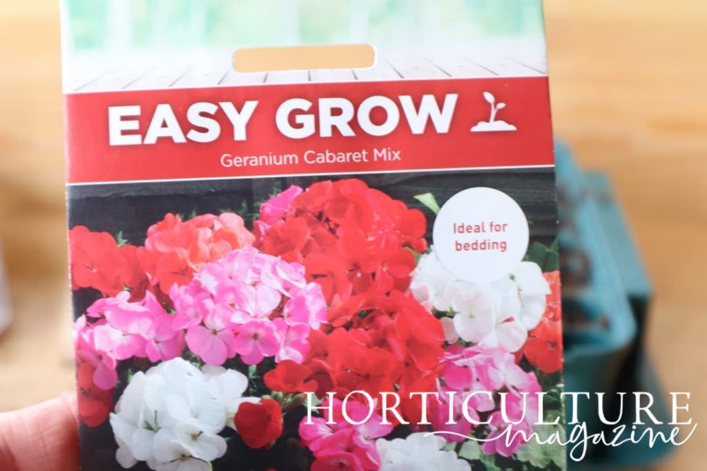 geranium cabaret mix seed packet shown in focus, with growing tray in background