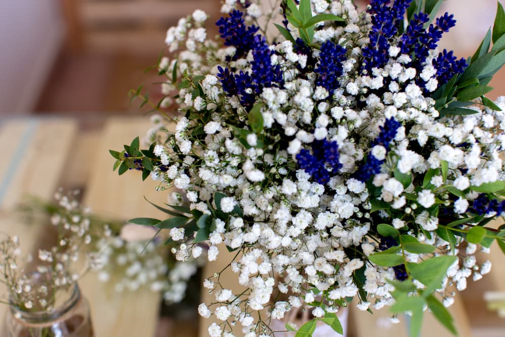 a fragrant wedding bouquet filled with baby's breath, eucalyptus and lavender