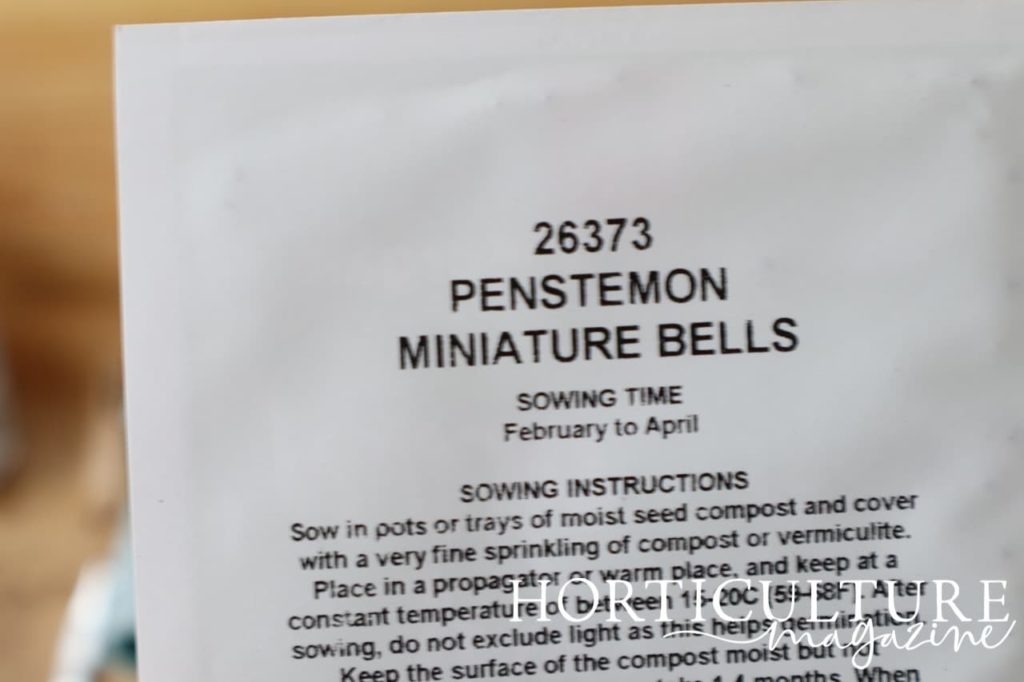 a packet of seeds labelled 'Penstemon Miniature Bells'