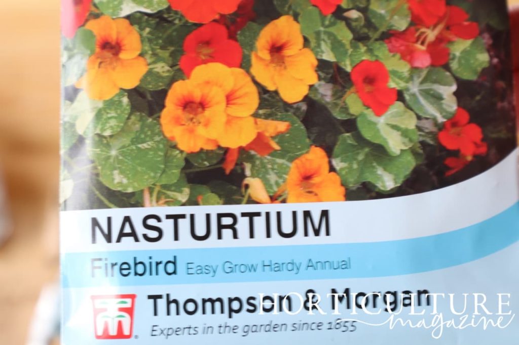 a seed packet from Thompson & Morgan labelled 'Nasturtium Firebird - Easy Grow Hardy Annual'