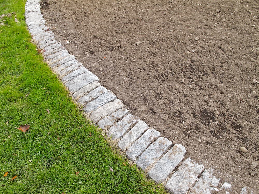 an open tilled garden border ready for planting