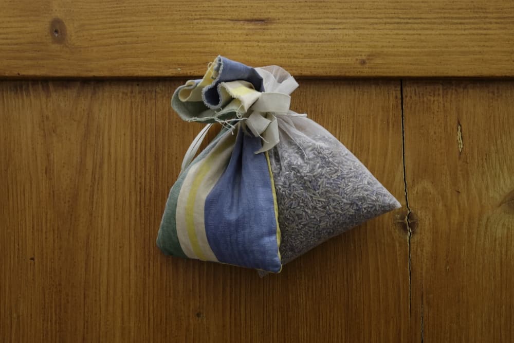 lavender bags sat on a wooden surface