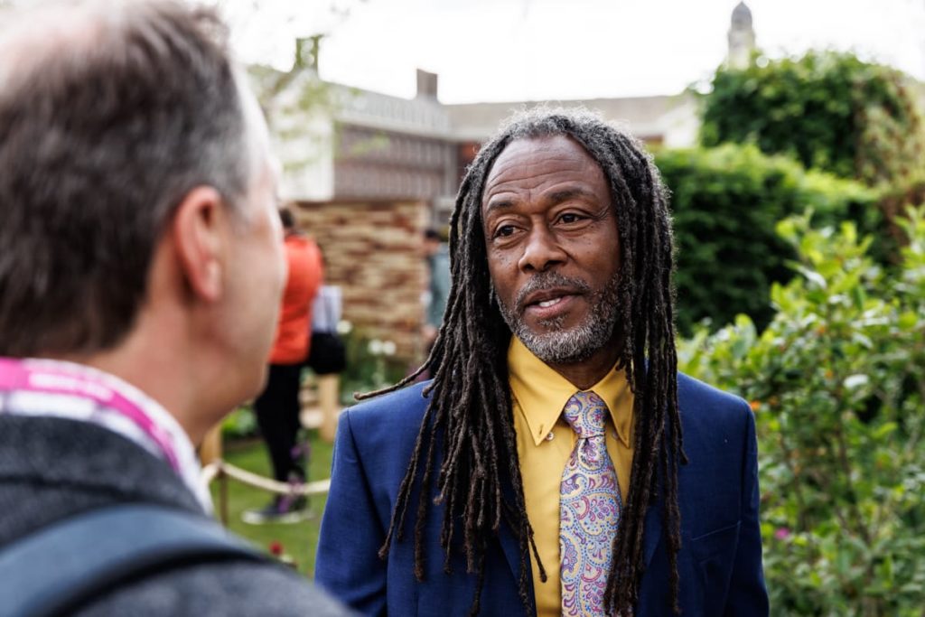 danny clarke 'The Black Gardener' speaking to guests at the RHS flower show