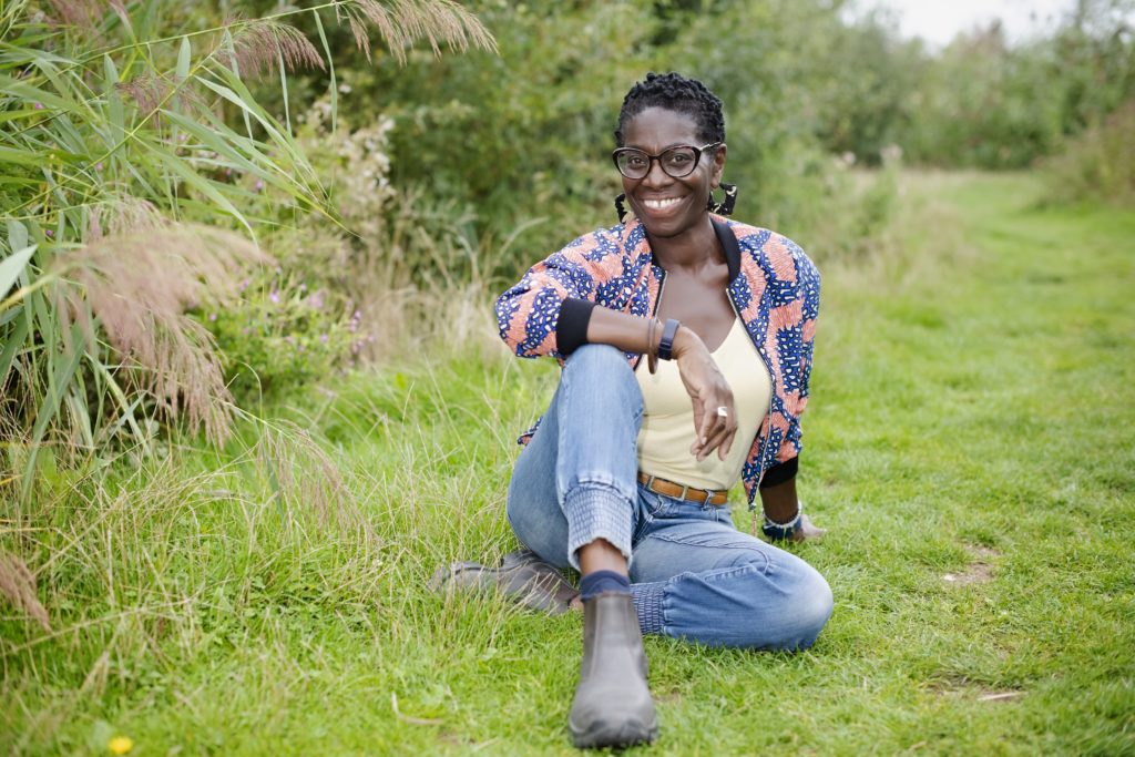 Flo Headlam sat on the grass