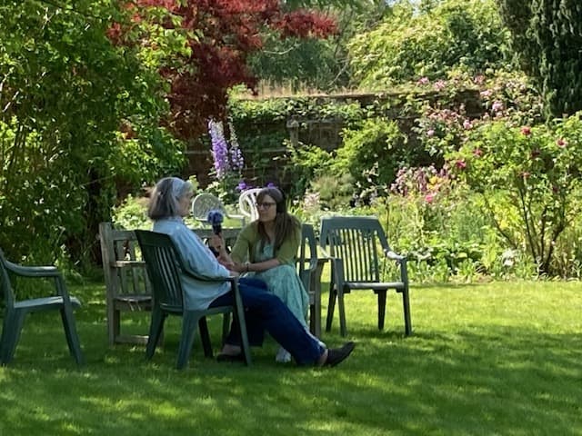Sally Flatman interviewing Diana Boston in a garden