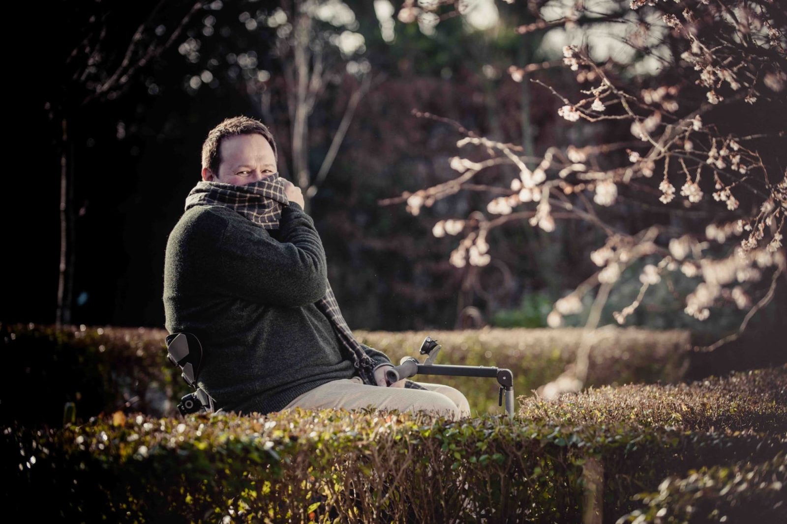 Mark Lane sat in a winter garden in the cold