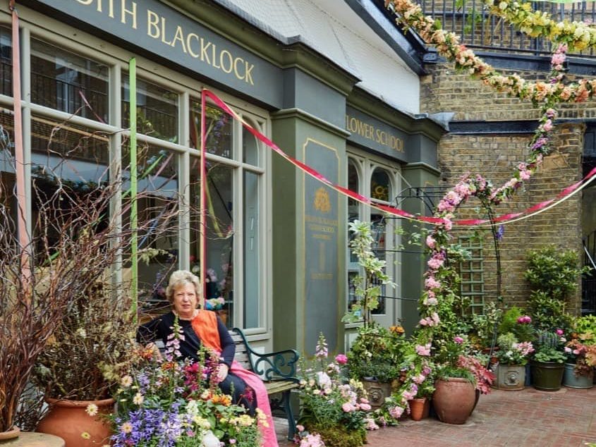 Judith Blacklock sitting outside of her flower school in Belgravia