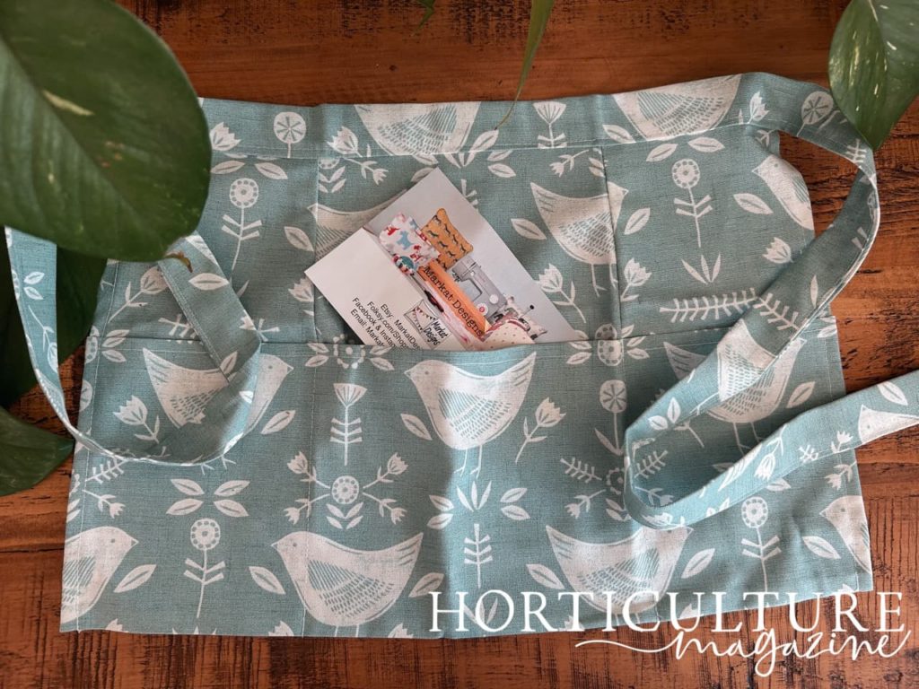 open apron with a pretty white bird design from Markat Designs