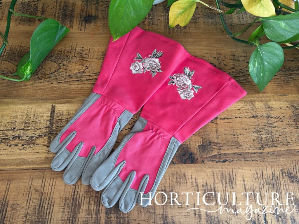 bright pink long gardening gloves with a floral detail on the sleeve from Intra Fit