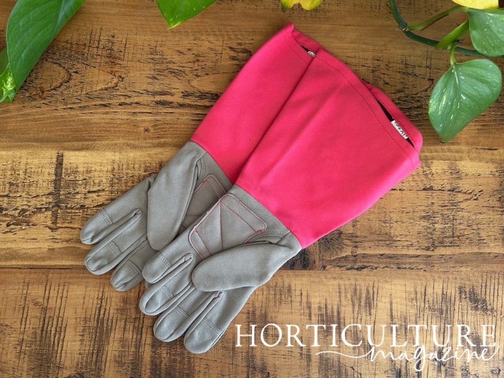 long gardening gloves with grey fingers and a pink sleeve