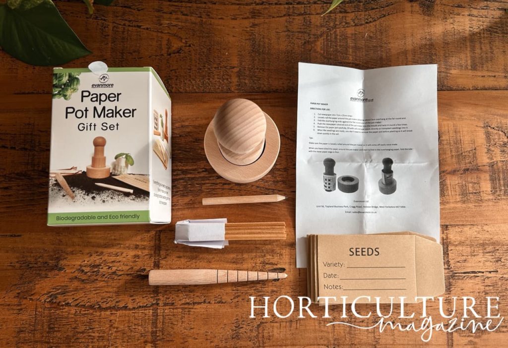 the contents of the paper pot maker gift set laid out on a table