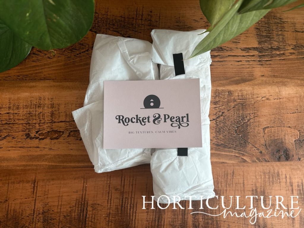white tissue paper wrapping up the product from Rocket and Pearl