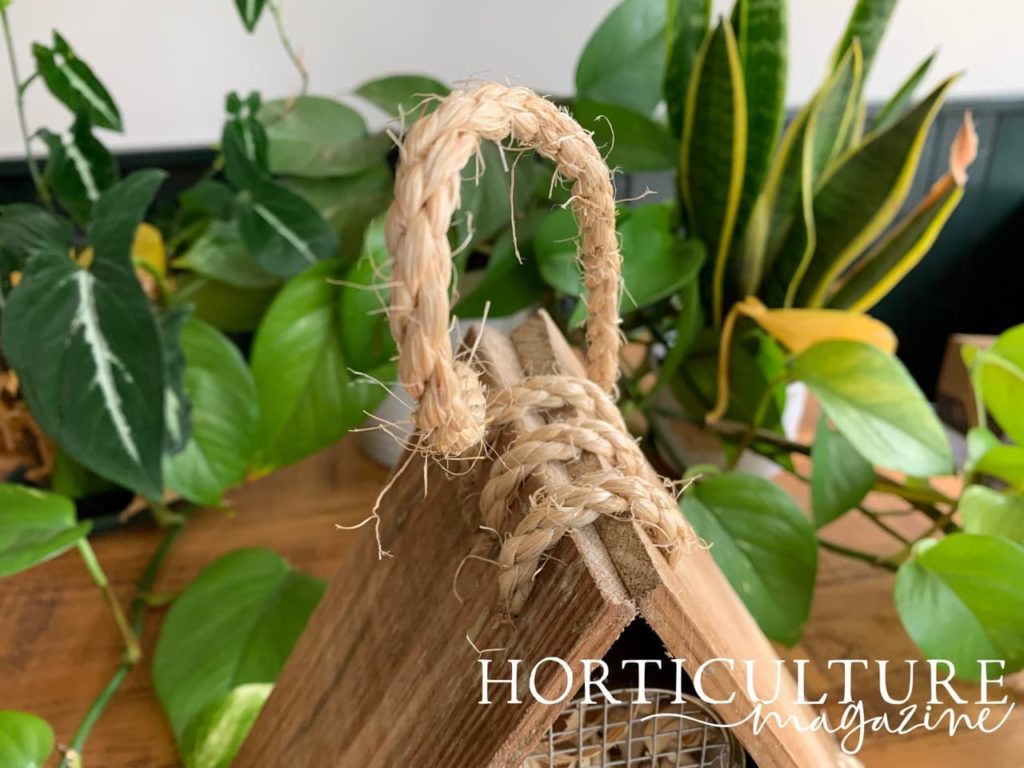 closeup of the rope hanger attached to the top of an insect hotel