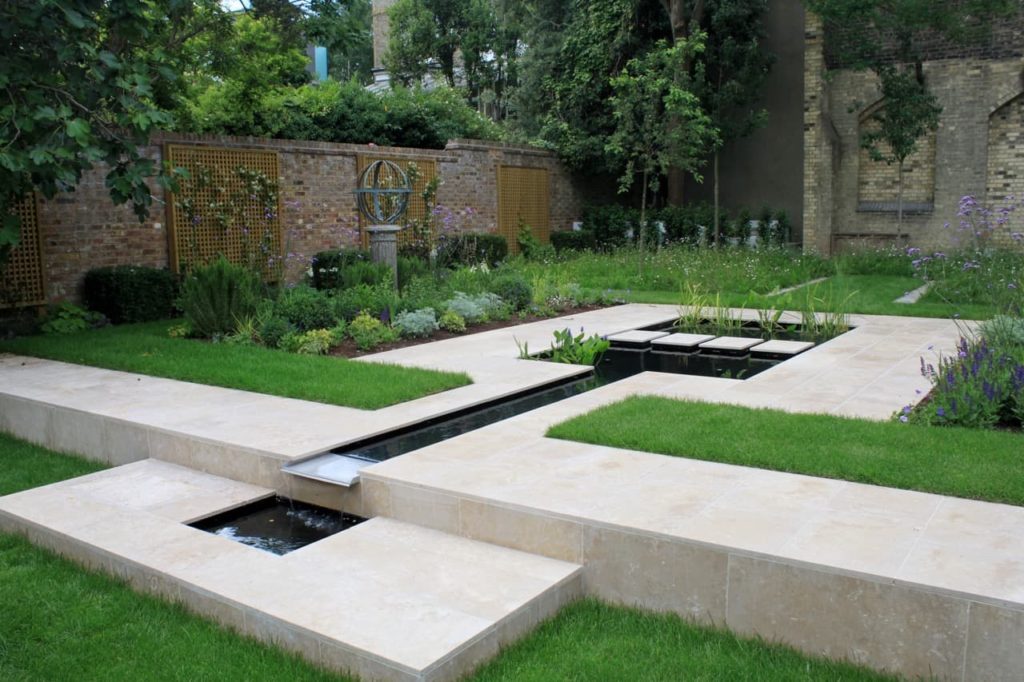 garden designed by Peter Reader with a large water feature in between lawned areas