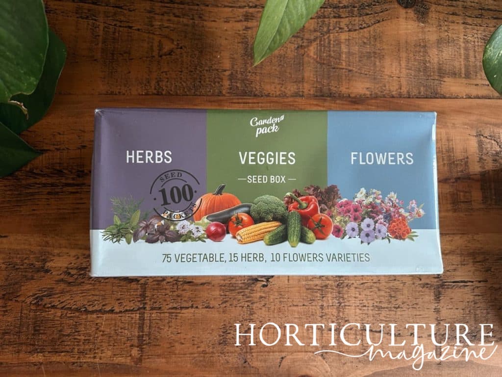 vegetable, flower and herb seeds inside a garden pack box