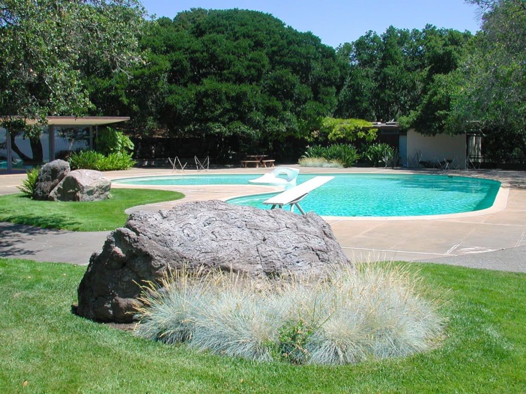 El Novillero by Thomas Church in California with a pool and well-maintained lawns