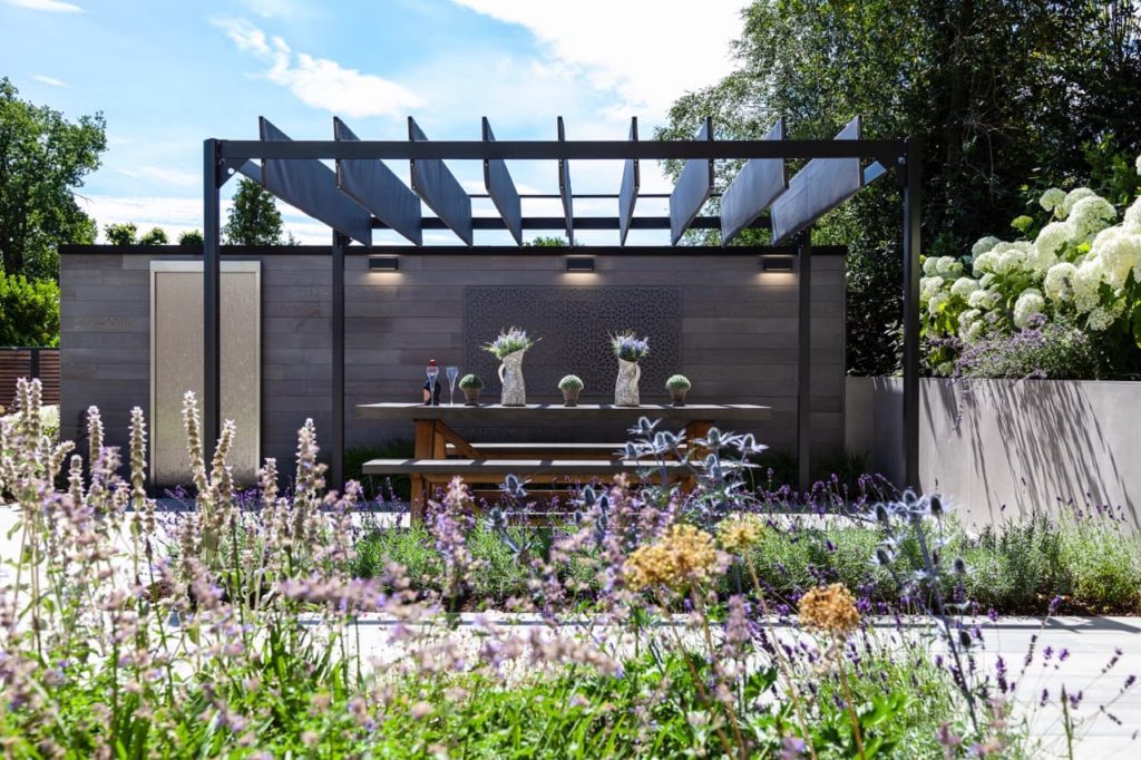an open patio area and outdoor seating space designed by Raine Clarke-Wills