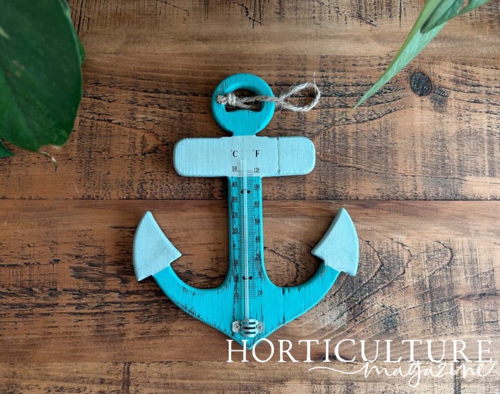rustic, blue outdoor thermometer shaped like an anchor from Shopalition
