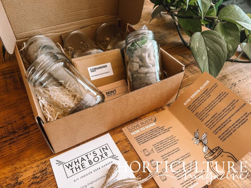 the instructions and glass jars on display from the indoor herb garden kit