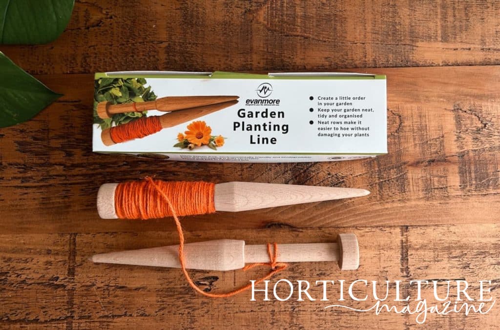 garden planting line with orange string next to its box