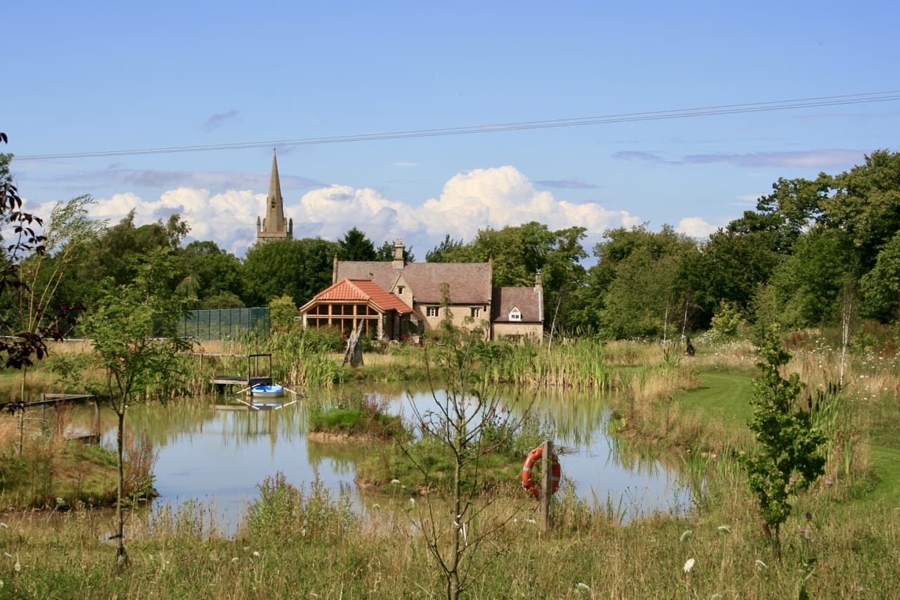 a cottage garden with a pond designed by Ian McBain