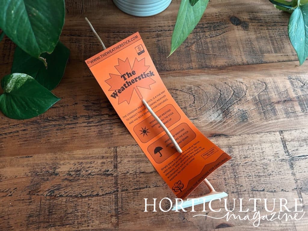 the Canadian weatherstick on a wooden table in its orange packaging