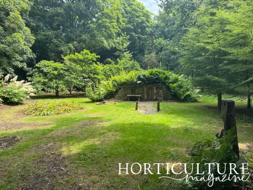 the stumpery at Burnby Hall Gardens with a little house covered in ferns at its centre